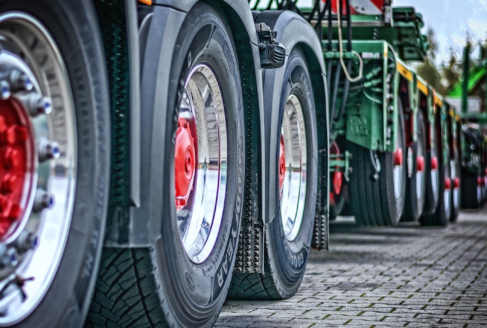 Close-up of shiny truck tires in parking lot